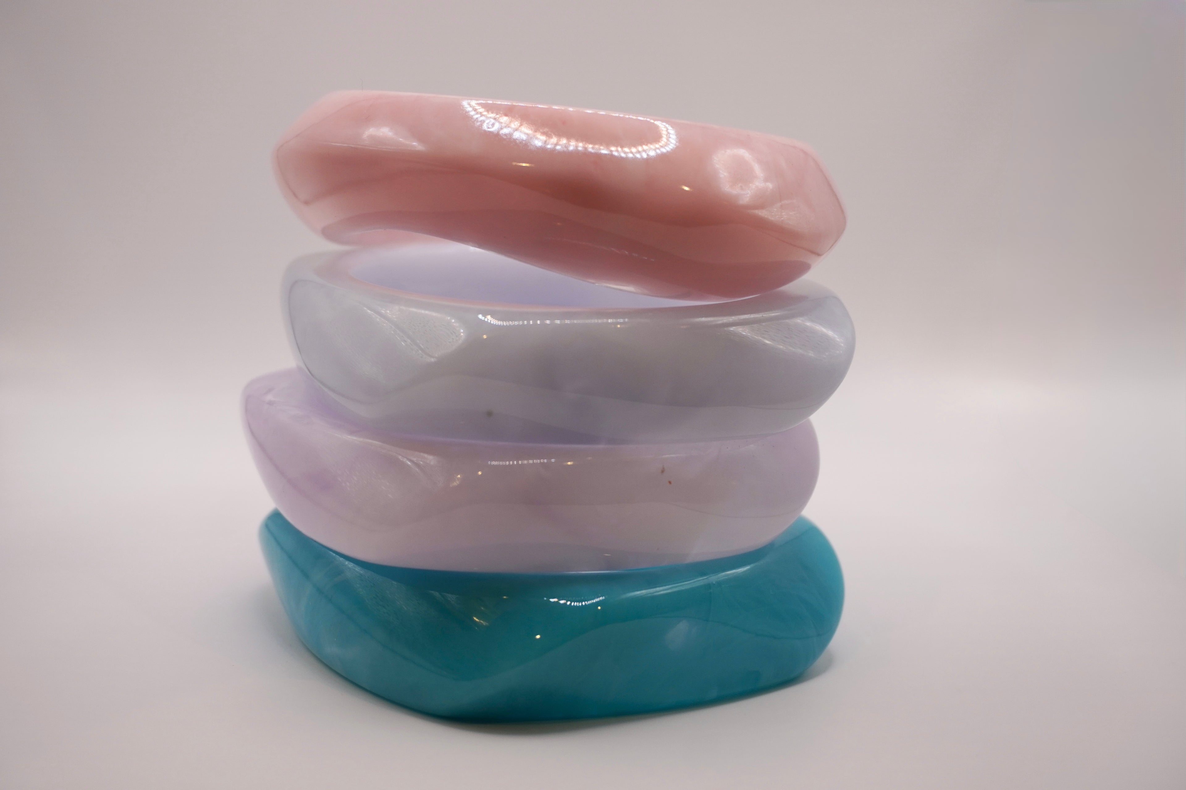 Stacked pastel bangles