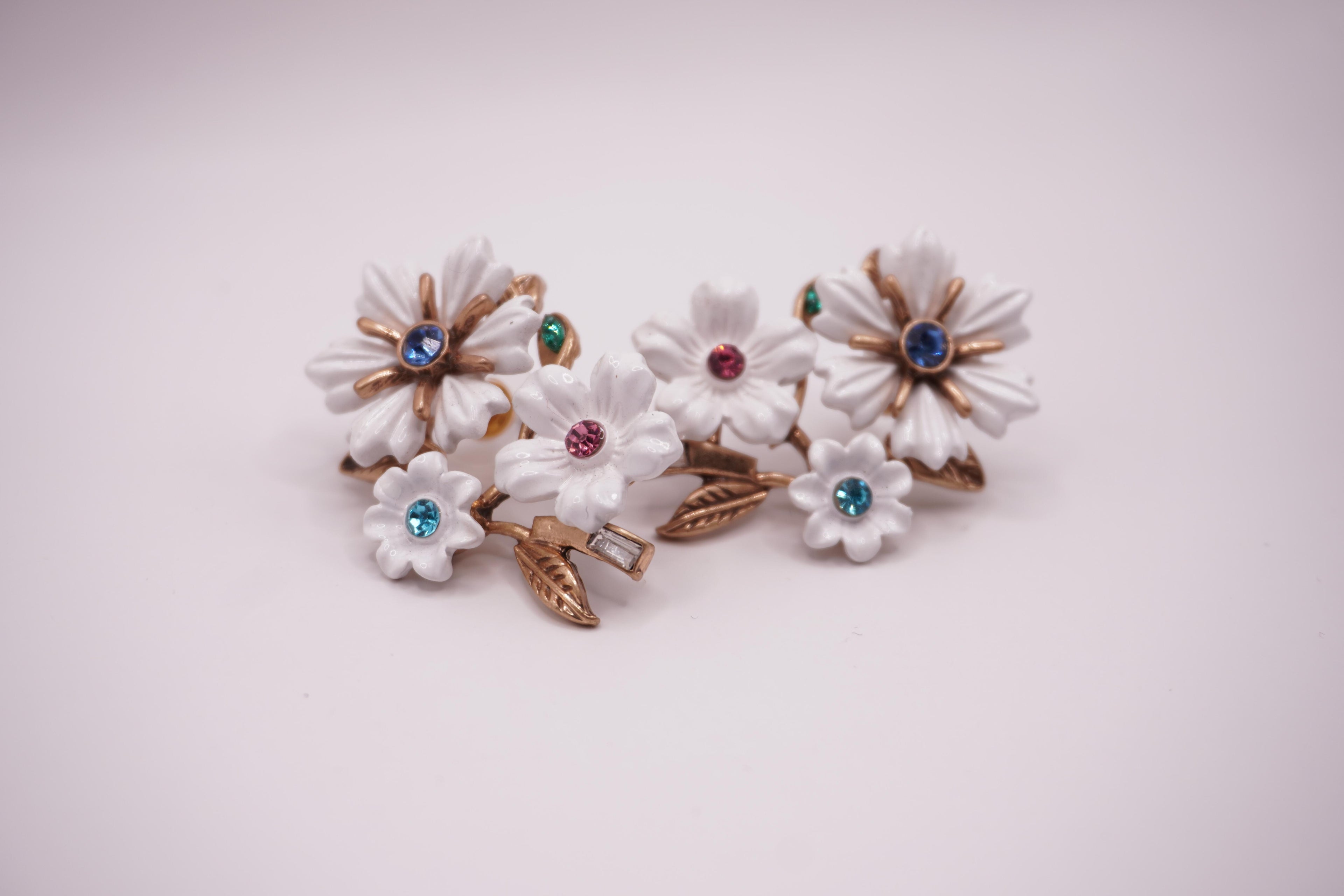 White enamel floral studs